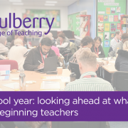classroom of approx 20 adult learners working at desks with laptops and notebooks. with the mulberry logo to the left hand side with the test " a new school year: looking ahead at what's to come for beginning teachers" across the bottom on top of a purple background.